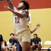 Damond Matthews shoots a baseline layup