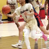 Camren Hunt attempts a scoop shot