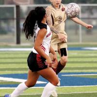 Amya Lindsay uses her upper body to knock down a keeper kick
