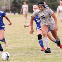 Ashley Monterossa runs past two defenders