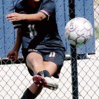 Gladis Avalos follows through on a corner kick