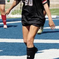 Haven Fleenor chases down a loose ball in front of the Cougars net