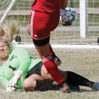 Kennedy Hendren grimaces as she collides with a player