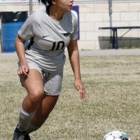 Riley Robertson dribbles up the field