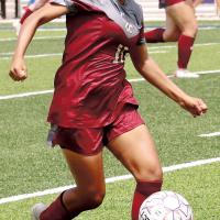 Gladis Avalos dribbles the ball up the field