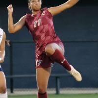 Makynzi Spencer-Friday tries to clear out a ball from the Cougars end of the field