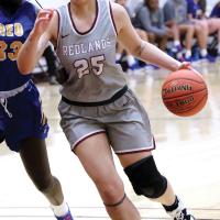 RCC women's basketball_Jackson drives around defender