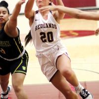 Kristen Murcer protects the ball while shooting in traffic