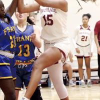 Jaiana Wiggins battles for control of the basketball under the goal
