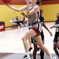 Katelyn Harviston shoots a fastbreak layup