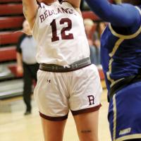 Amaia Maxwell tries to shoot over an NEO defender
