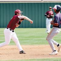 Alex Everett makes a throw-in attempt to complete a double play against Seminole