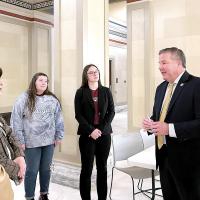 Redlands Community College students and faculty visit with Sen. Lonnie Paxton during Higher Education Day at the Capitol