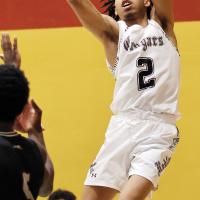 Treston Gage shoots a baseline jumper