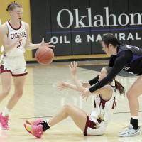 Katelyn Harviston (15) reaches out to grab a pass from sister Karlee Harviston (24) after she forced a turnover