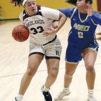 Isabella Stafford (33) dribbles past a defender