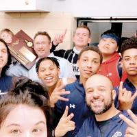 El Reno boys celebrate after beating Southeast