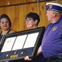 Amy Stout, left, and Nancy Salsman are shown with Mitch Reed