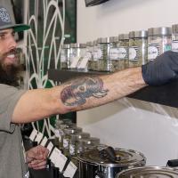 Mike Costin sorts out jars of products