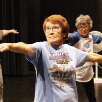 Cherri Brandley holds a yoga stance in the RCC Fitness Center’s chair yoga class