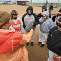 Calumet slow-pitch softball coach Karly Murray gathers her team