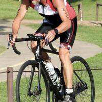 Shannon Eichholz pedals up a hill through Adams Park