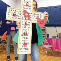 Roxanne Jorski shows one of the class projects auctioned
