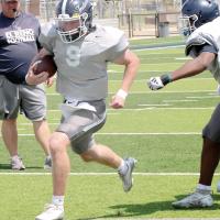 Rustyn Cook slips past a teammate on his way to scoring