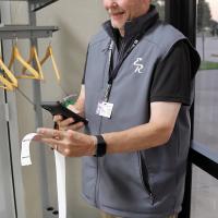 Matt Goucher uses his cellphone to snap a picture of a printout of voting totals