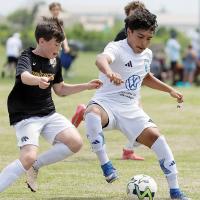 Youth soccer players from Texas are shown competing in an Oklahoma tournament