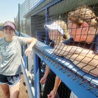 Bri Michalicka talks with players during a summer league game