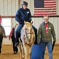 Heath Shelton guides SSTRP horse Popcorn around the riding arena