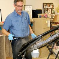 Cain uses a pump sprayer