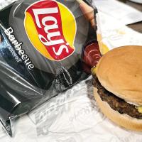 A bag of chips and a cheeseburger which was part of a meal being served to local children during ERPS summer food service
