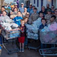 The boys and girls and adult leaders who took part in the Scouting for Food Drive