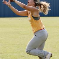 Shayne Castrop makes a backhand grab during outfielder drills