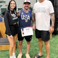 Brandon Shelton (center) stands with his wife, Kyla and George Burton