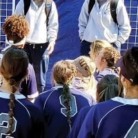 EHS head softball coach Kylee Webb listens to former coach Davee Deaton