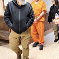 Stacey Lee Drake is led into Sequoyah County District Court in handcuffs
