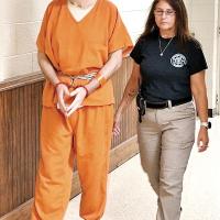 Stacy Lee Drake is escorted by Sequoyah County Jail personnel