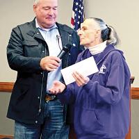 Steve Jensen turns the microphone over to Nikki Pruitt