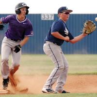 Garrett March reaches out to snag a late pickoff throw