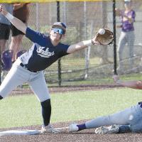 Gage Lesperance reaches over a sliding Okarche base runner to try and snag a pickoff throw to the bag