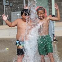 J.R. Chavez and Carl Richey react to a bucket of cold water being poured on their heads