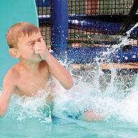 Tay Stroman holds his nose as he hits the water