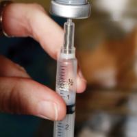 The Moderna COVID-19 vaccine being drawn up into a syringe