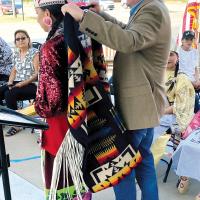 David Black presents a blanket to Miss Denver March
