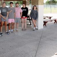 Mike Booher talks with the lifeguards who will work at the municipal swimming pool