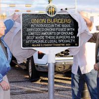 Otis Bruce and Robert Sanders join with Ed Graham (behind the sign), Marty Hall and Lacey Brickey