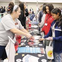 Kayna Beardsley shares information with students during last year's College and Career Fair